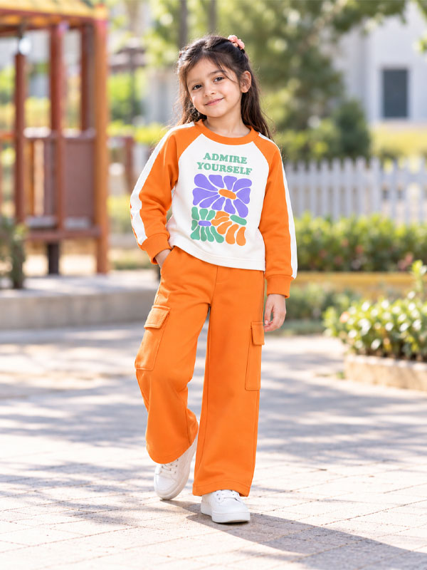 Girl wearing Girls Admire Yourself Orange Cargo Tracksuit Set